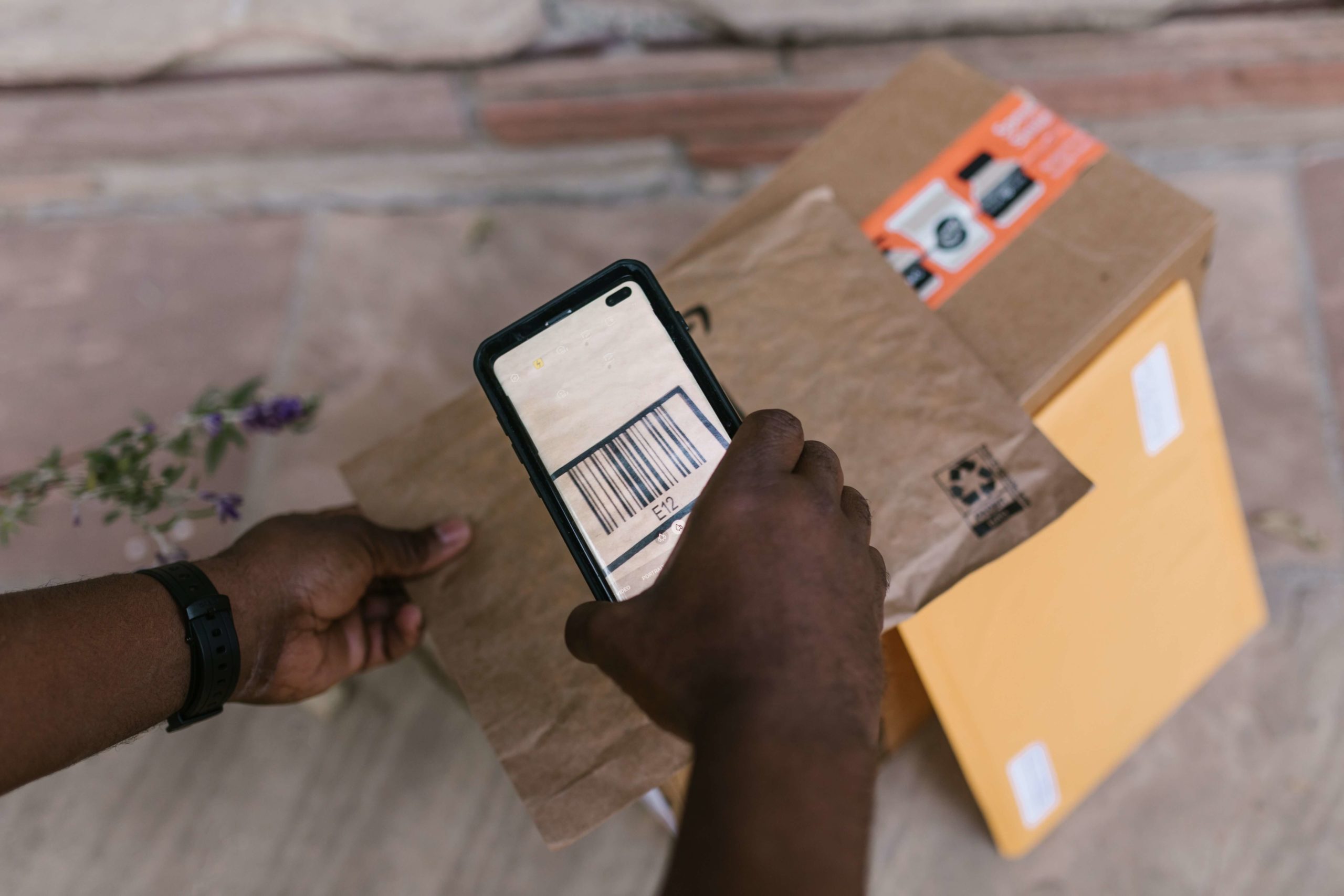 Scanning the barcode on the parcel via the phone